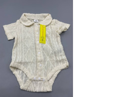 cream-colored knit baby bodysuit designed for infants aged 1 to 3 months, featuring a collared neckline and snap closures. cream-colored knit baby bodysuit designed for infants aged 1 to 3 months, featuring a collared neckline and snap closures.