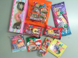 A set of 9 packages of chewing gum, in different shapes