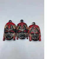Set of 3 Handmade wooden masks from the Maasai people of Kenya, traditionally dyed red and black. A great souvenir.