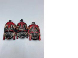 Set of 3 Handmade wooden masks from the Maasai people of Kenya, traditionally dyed red and black. A great souvenir. Set of 3 Handmade wooden masks from the Maasai people of Kenya, traditionally dyed red and black. A great souvenir.