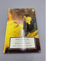 The cover of a poetry anthology titled "Twenty Love Poems and Songs of Despair" by Pablo Neruda is believed to have been published by Penguin, as evidenced by the penguin logo in the upper right corner.