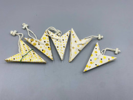 Set of 5 These white and gold foldable paper star lanterns are often used as festive Scandinavian-style decorations for Christmas, weddings, or parties. 