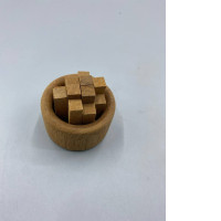 This wooden essential oil diffuser is designed in the shape of a stack of wood, with a circular base.