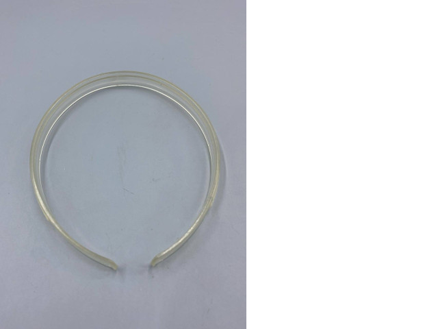 An antique tensioning ring for an acrylic watch glass, likely a part used for repair. An antique tensioning ring for an acrylic watch glass, likely a part used for repair.