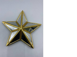 This product is a five-pointed star wall decoration made of mirror glass with a gold frame.