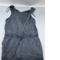 Bella Dahl's grey linen jumpsuit with a criss-cross back, drawstring waist, and pockets.