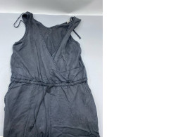 Bella Dahl's grey linen jumpsuit with a criss-cross back, drawstring waist, and pockets.