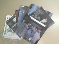 A set of photos of a Korean music group, plus a folder for storage. A set of photos of a Korean music group, plus a folder for storage.