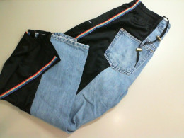 Trousers with denim inserts Trousers with denim inserts