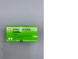 Packaging for tolchicine tablets, a medication used to treat and prevent gout flare-ups.