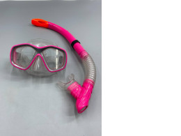 pink and gray snorkeling set, which includes a diving mask and a dry-top snorkel. pink and gray snorkeling set, which includes a diving mask and a dry-top snorkel.