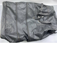 A large black suitcase or a convertible garment bag.