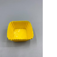 Set of 3 Yellow square silicone baking cups, often sold in sets for baking cupcakes or muffins.