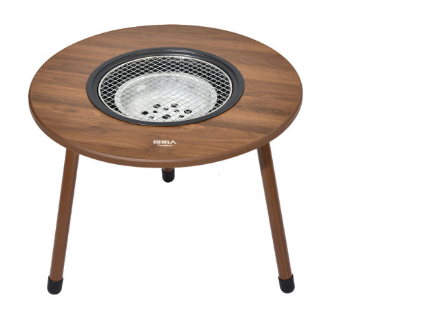 Round outdoor barbecue table with three legs. Round outdoor barbecue table with three legs.