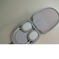 The Sony headphones are not new and come with a case.