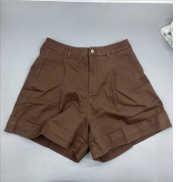 Brown pleated Bermuda shorts, in the style of the brands Love Bonito or P.A.R.O.S.H.