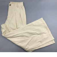 Cream-colored, high-waisted wide-leg trousers, Bennett model.