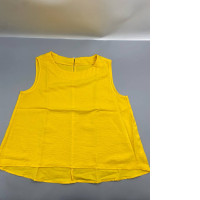 A bright yellow sleeveless top or tunic, similar in style to the FLAX brand.