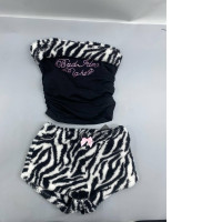 velvet top and shorts set with a Y2K-style zebra print, embellished with faux diamonds, from the brand ROMWE. velvet top and shorts set with a Y2K-style zebra print, embellished with faux diamonds, from the brand ROMWE.