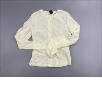  white eyelet or lace-textured cardigan sweater featuring a crew neck and front button closure. 