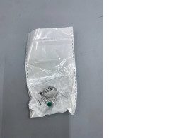 Fashion ring with green beads.