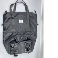 A foldable and expandable duffel bag with wheels for use as a wheeled suitcase.