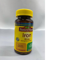  Nature Made Iron 65 mg (325 mg Ferrous Sulfate) tablets, a dietary supplement used to support red blood cell formation and treat iron deficiency. 