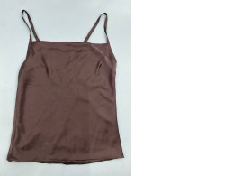 brown satin camisole top featuring thin straps and a square neckline. brown satin camisole top featuring thin straps and a square neckline.