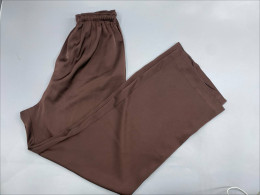 Brown satin wide-leg trousers from H&M.