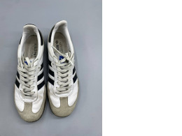 Adidas Samba OG shoes in a classic white and black colorway. 