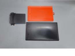 Set of 3  Huion graphics drawing tablets, including models like the HS611 (coral red) and likely the H1161 or H950P. 