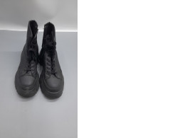 Black, lace-up, military-style boots with a thick, high heel, a style from the Zara brand. Black, lace-up, military-style boots with a thick, high heel, a style from the Zara brand.