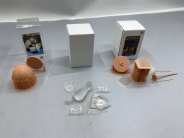 a set of three buildable toy figures