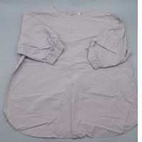 A loose-fitting blouse in light purple or beige with puffed sleeves.