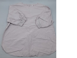 A loose-fitting blouse in light purple or beige with puffed sleeves.