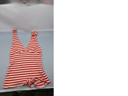 Deep V-neck knitted jumpsuit in red and white stripes.