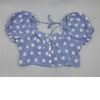 A cropped top with puffed sleeves, a small floral print, a front tie closure, and ruffle details from the brand SHEIN Essnce.