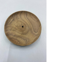 A wooden incense holder or stick holder.