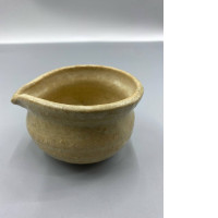 A pitcher with a narrow spout for pouring water. A pitcher with a narrow spout for pouring water.