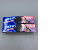 set of 2 Oreo sandwich cookies with blueberry and raspberry cream filling.