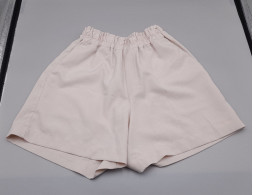 Cream-colored shorts Cream-colored shorts