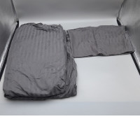 Dark gray bed sheets and pillowcases.