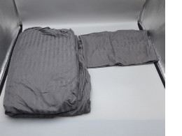 Dark gray bed sheets and pillowcases. Dark gray bed sheets and pillowcases.
