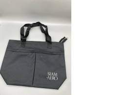 A black fabric bag with the "SIAM AERO" logo. A black fabric bag with the "SIAM AERO" logo.