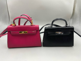 Set of 2  luxury handbags are Hermès Mini Kelly bags. 