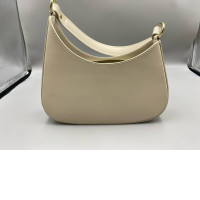 Beige shoulder bag, semi-circular shape, with zipper closure. Beige shoulder bag, semi-circular shape, with zipper closure.