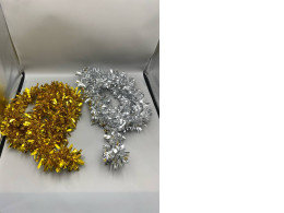 Set of 2 Decorative garlands made from shimmering silver and gold fibers.