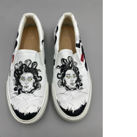 custom-painted Vans Classic Slip-On sneakers featuring a black and white illustration of Medusa with yellow eyes. 