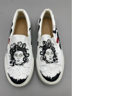 custom-painted Vans Classic Slip-On sneakers featuring a black and white illustration of Medusa with yellow eyes. 