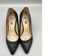 black leather pumps appear to be a style similar to the Sam Edelman Hazel Pointed Toe Pump. 